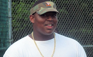 Settle, pictured here looking on at UVa's 7-on-7 Tournament in 2013