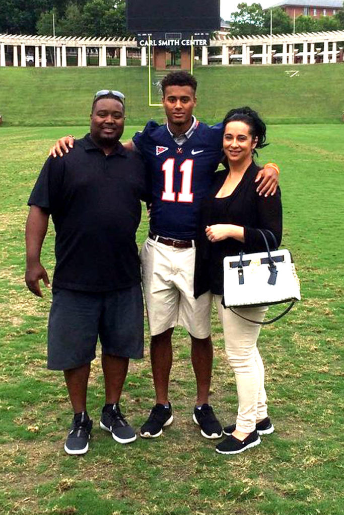 Jana with his parents in Scott Stadium