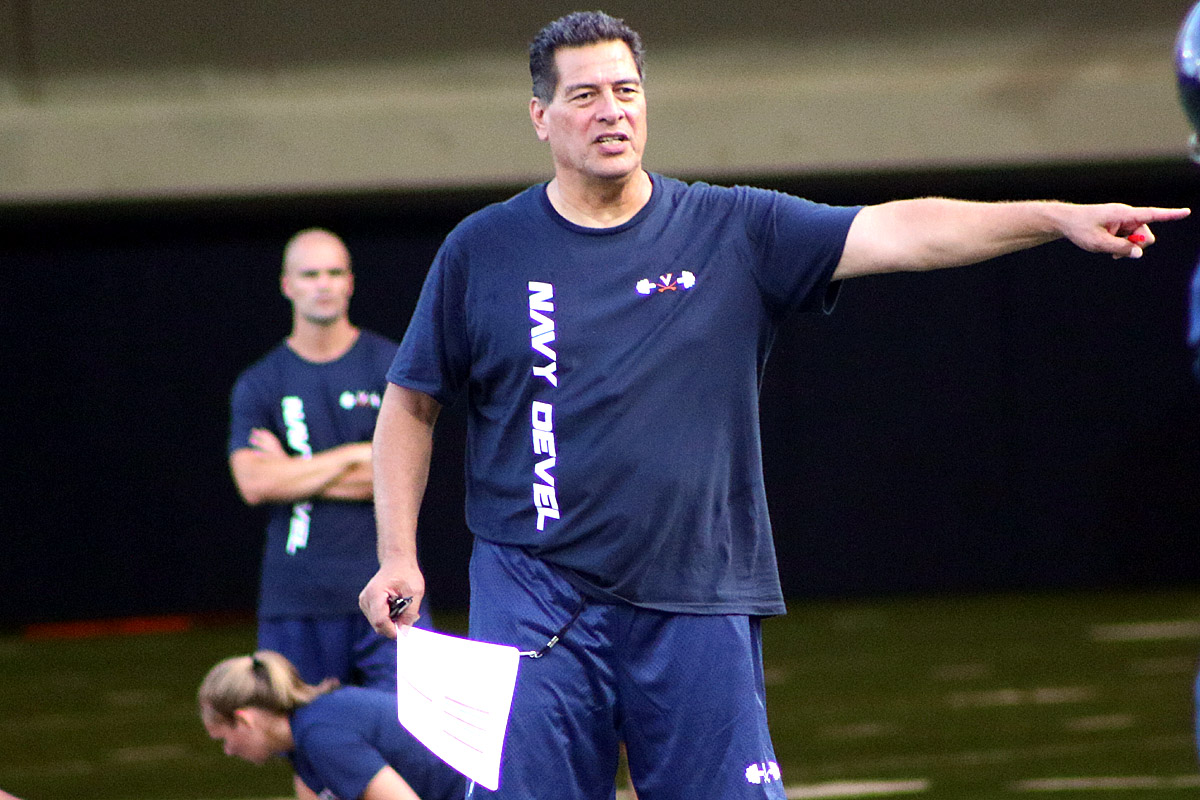 Robert Anae coaches Air Raid concepts at Virginia football practice.