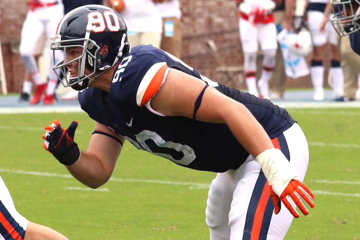 Jack Powers starts a play for the Virginia football team.